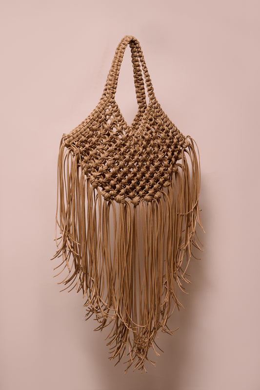 Brige macrame handbag with fringes on a white background
